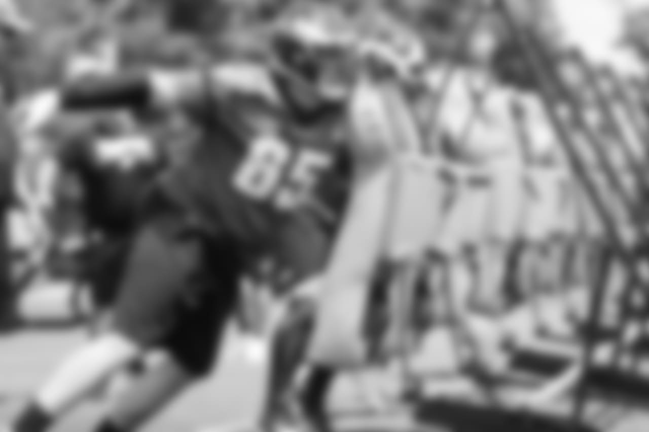 OT Lane Johnson hits the blocking sled.