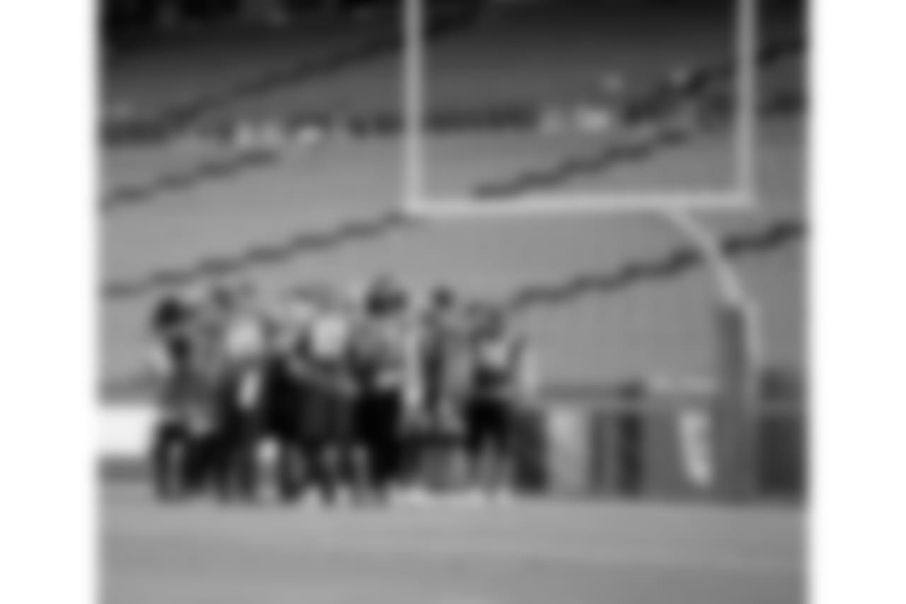 The Eagles huddle to start practice