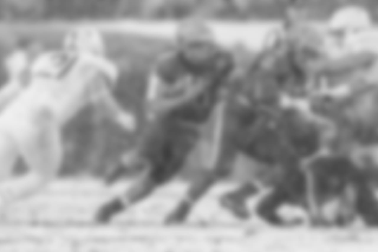 Navy QB Malcolm Perry runs the ball, as Army LB Alex Aukerman looks to make the tackle.