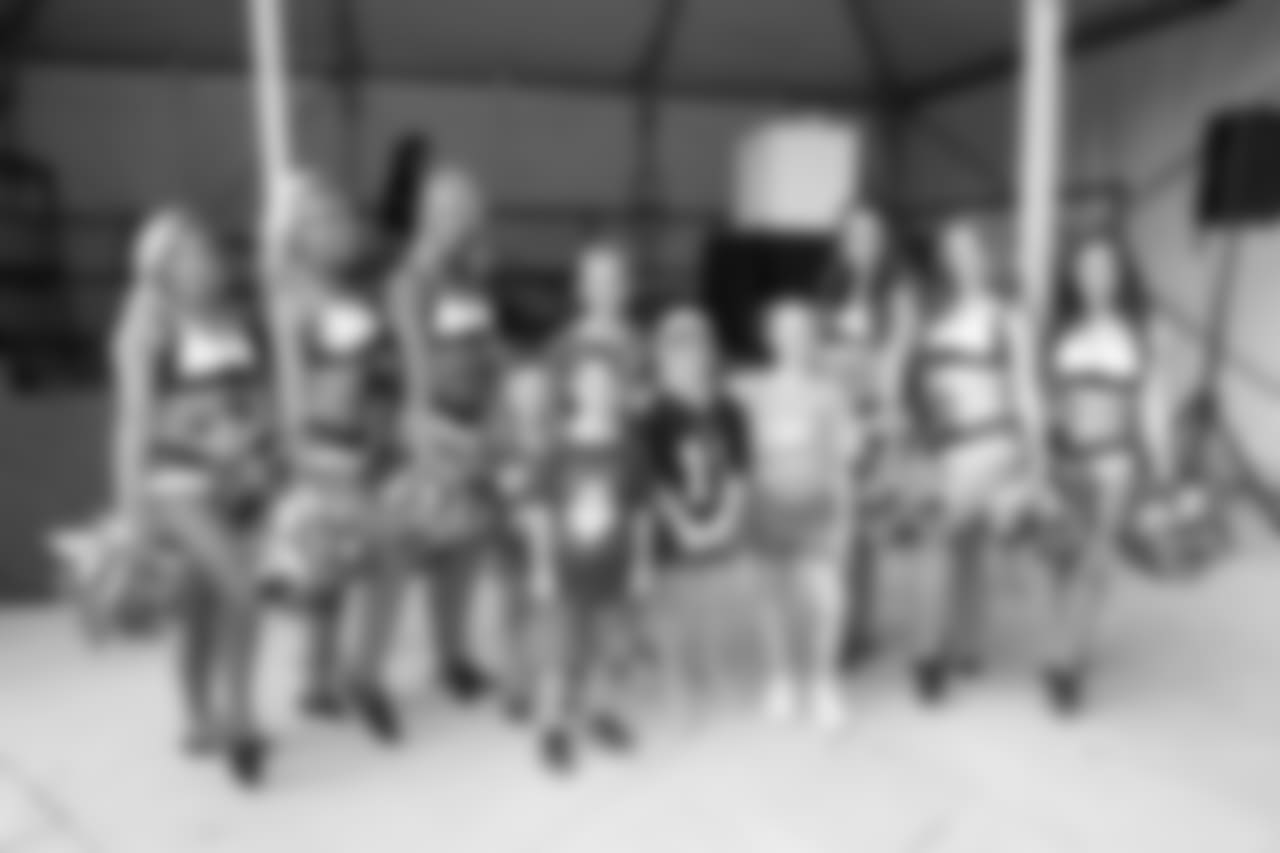 Fans pose for a picture with some of the Philadelphia Eagles Cheerleaders.