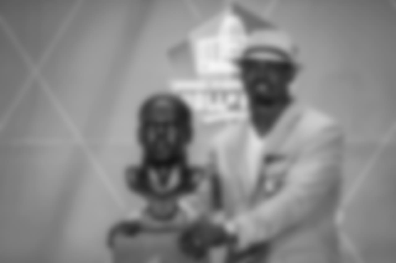Brian Dawkins poses with his bust after his speech