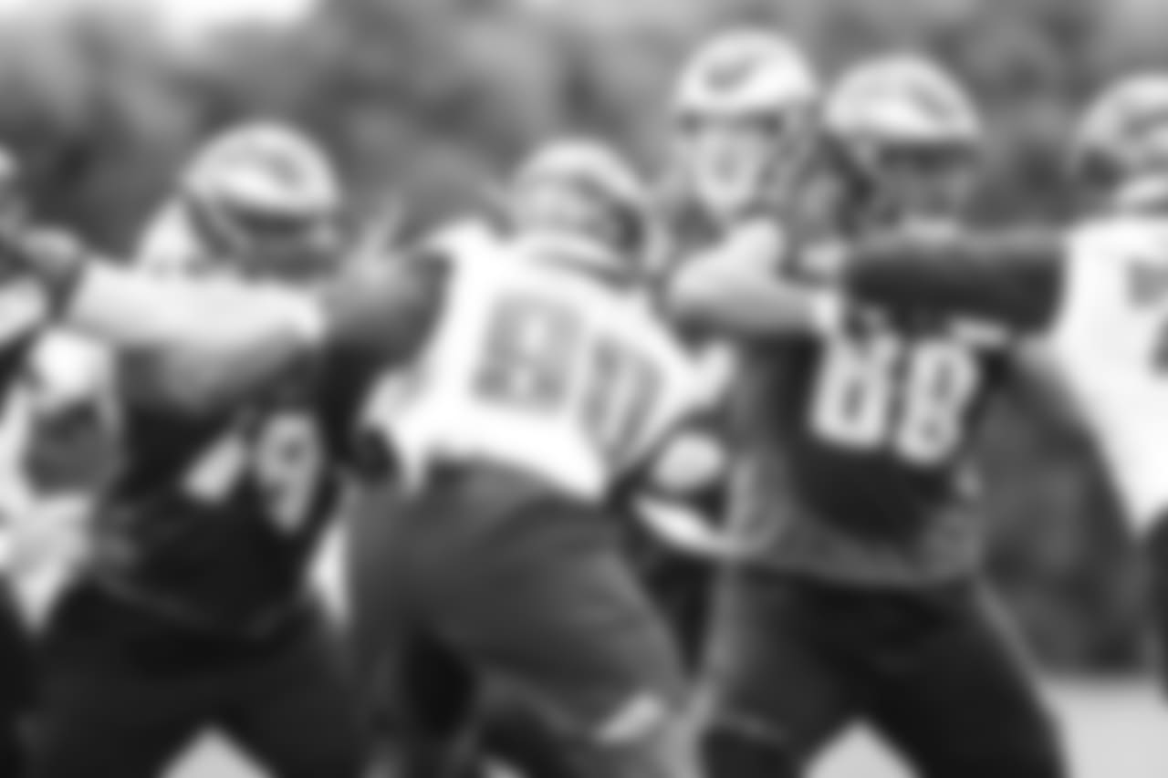 DE Aziz Shittu attempts to fend off blocks from Eagles offensive linemen.