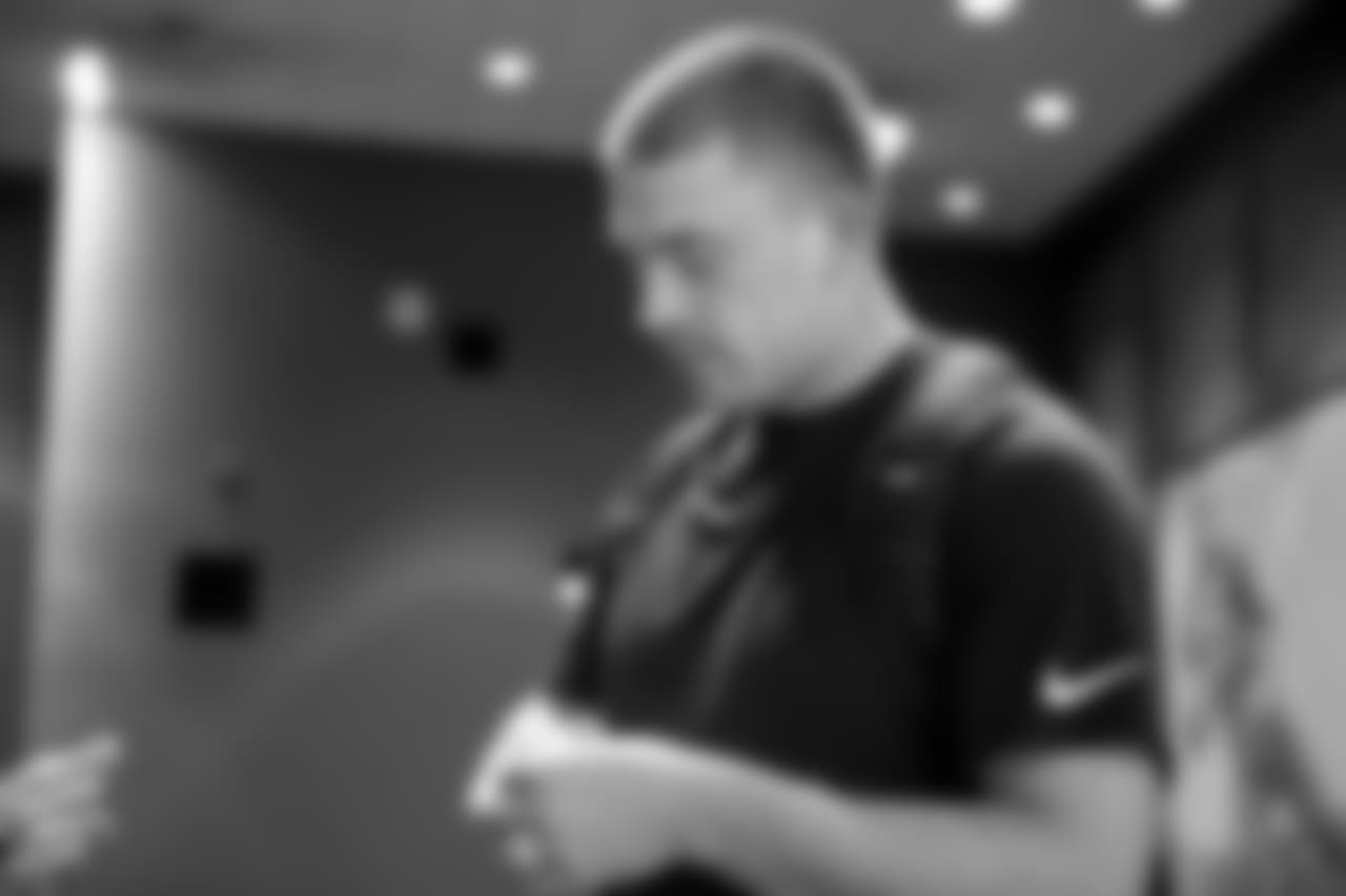 TE Zach Ertz checks the size of the ring.