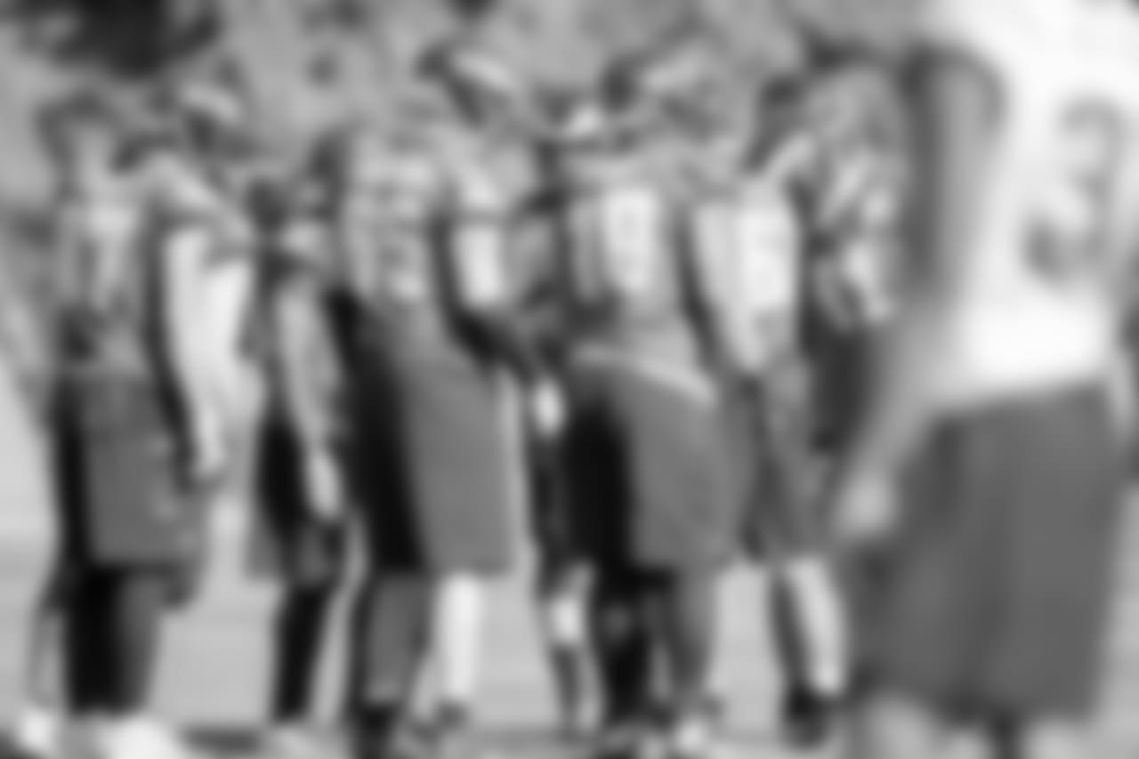 The offense huddles up