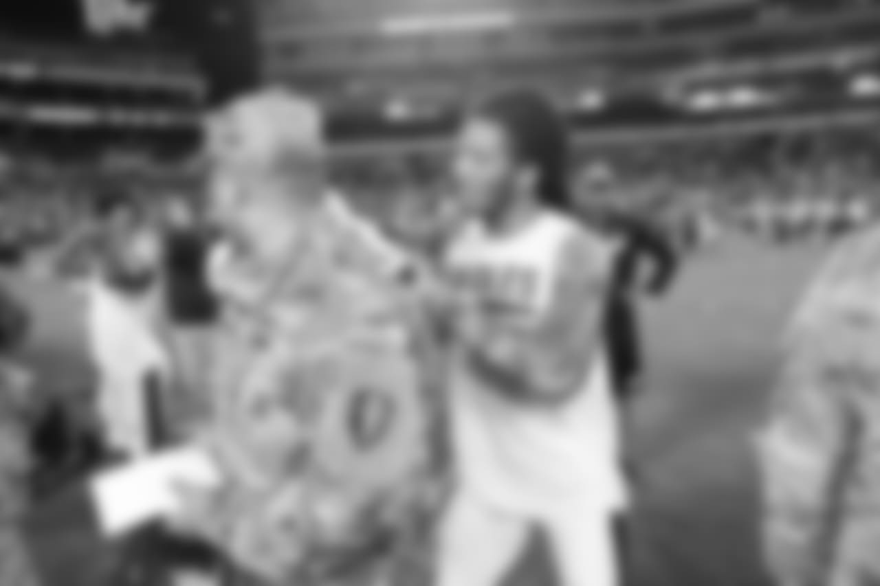 Sidney Jones signs an autograph during Military Appreciation Night