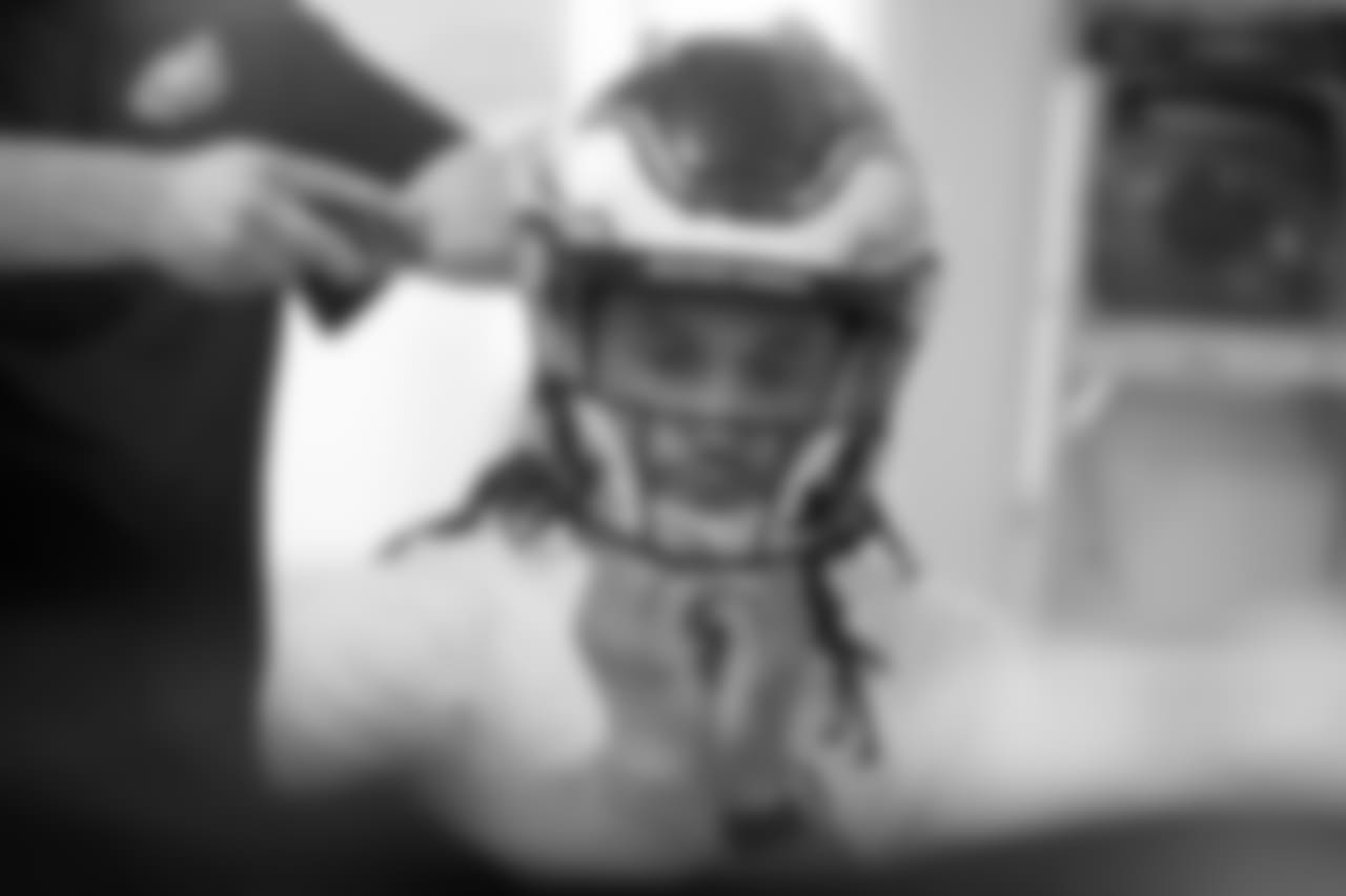 Maddox waits patiently as adjustments are being made to his new helmet.