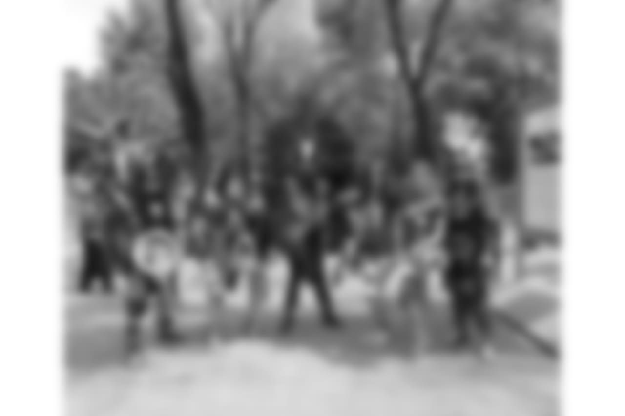 The cheerleaders took a photo with street performers in the Paseo de la Reforma area of Mexico City