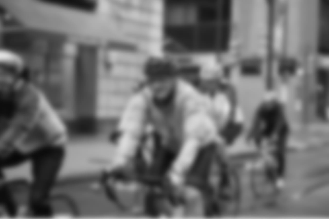 Cyclists make their way past Jefferson Hospital.