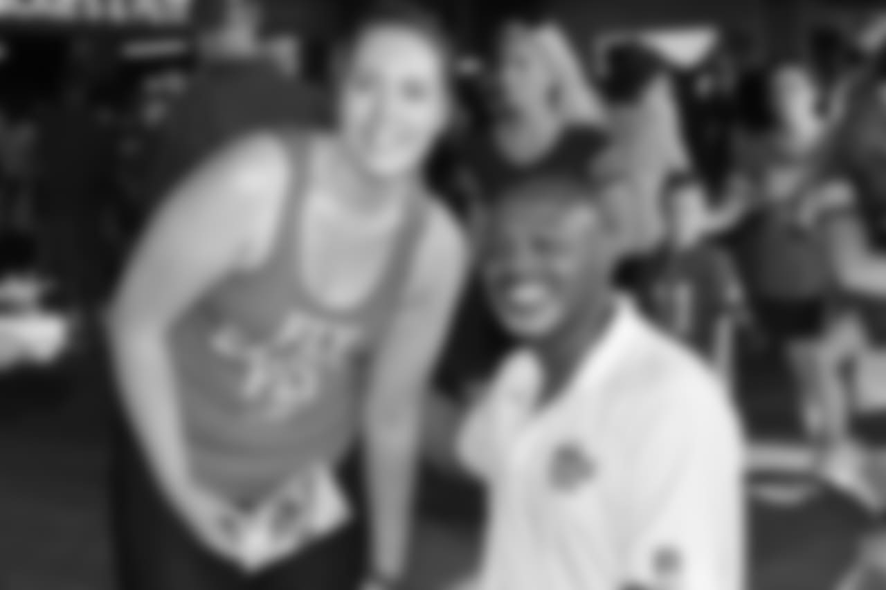 Eagles Alumni, Eagles WR Fred Barnett takes a photo with a fan.