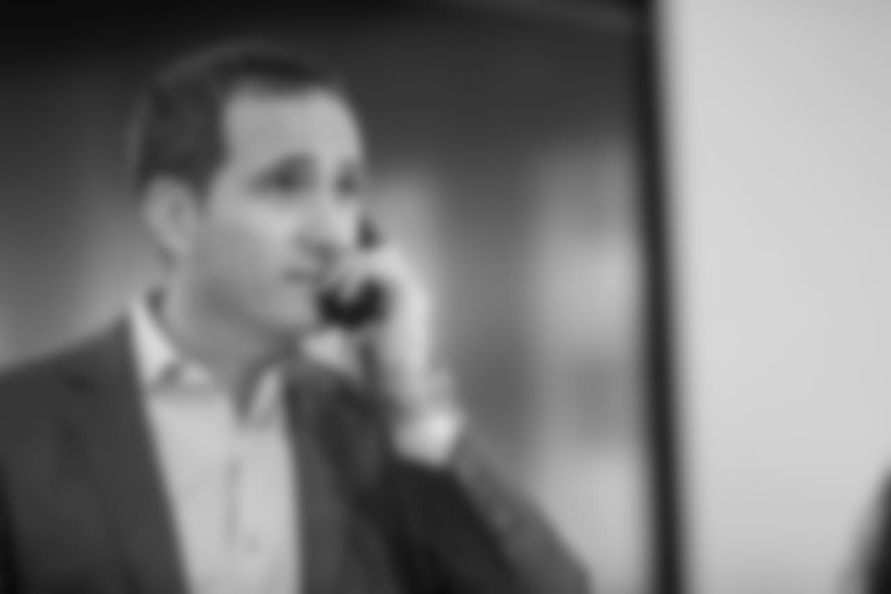 Roseman working the phones on Day 3 of the NFL Draft.