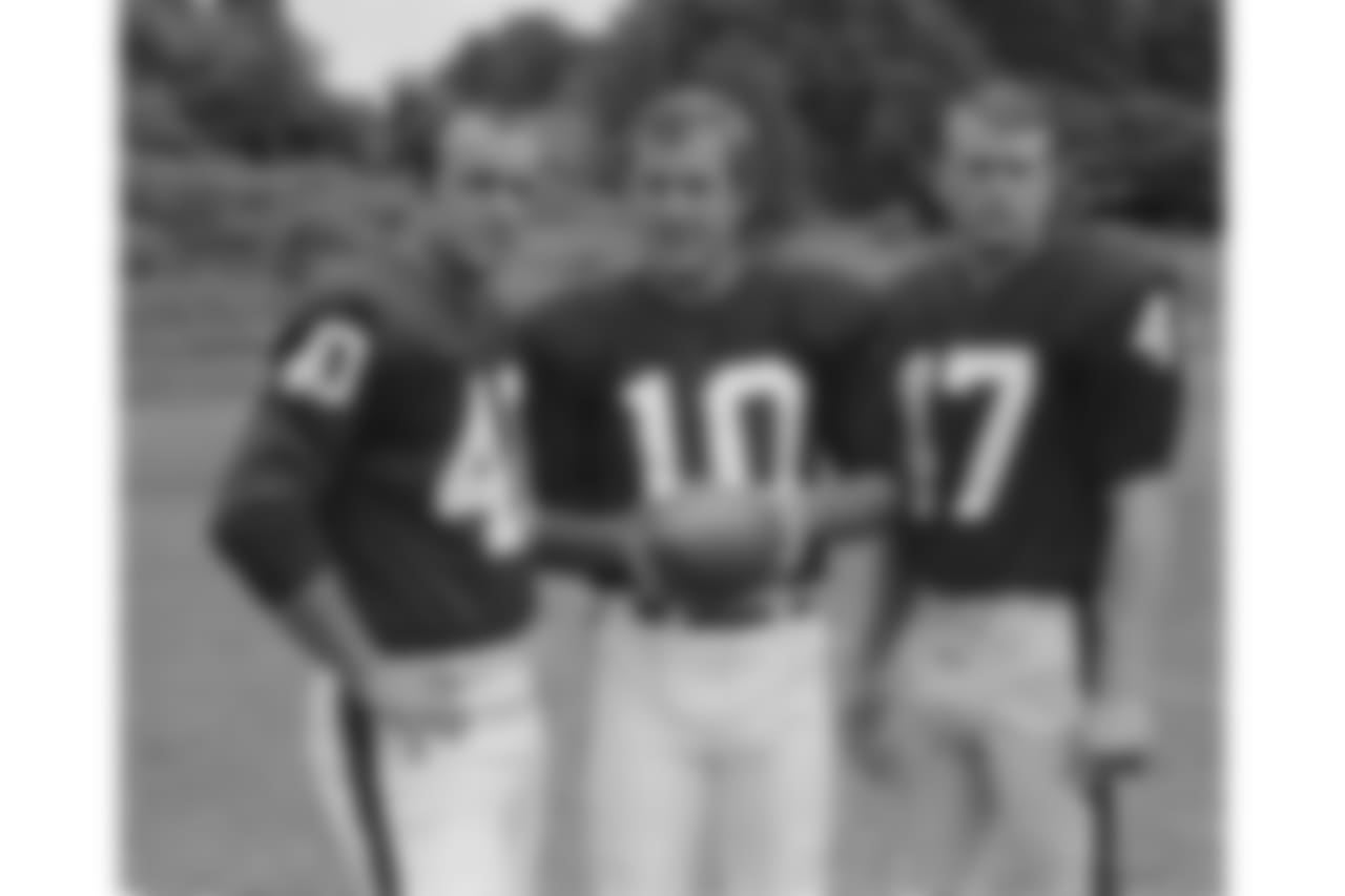 Fran Tarkenton, quarterback, New York Giants, (10) flanked by left Joe Morrison, and Joe Koontz (47) right, in 1968. (AP Photo)