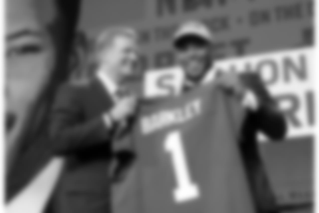 Commissioner Roger Goodell presents Penn State's Saquon Barkley with his New York Giants jersey during the first round of the NFL football draft, Thursday, April 26, 2018, in Arlington, Texas. (AP Photo/David J. Phillip)