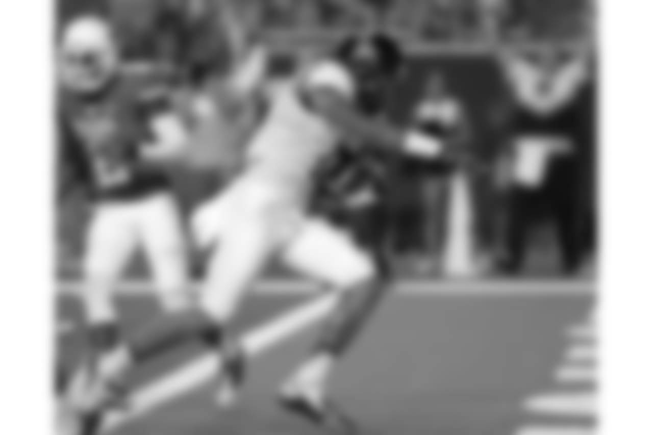 Evan Engram (17) scores a touchdown against Texas during the third quarter of an NCAA college football game Saturday, Sept. 14, 2013, in Austin, Texas.