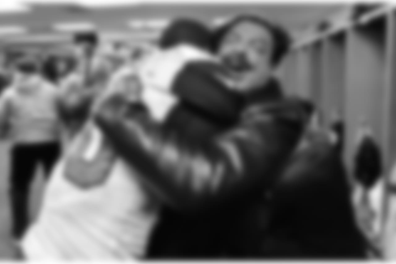 Jacksonville Jaguars team owner Shad Khan gives linebacker Telvin Smith (50) a huge bear hug in the locker room following the Jags 45-42 victory over the Pittsburgh Steelers in an AFC Divisional Playoff game Sunday, January 14, 2018 in Pittsburgh, PA. (Rick Wilson via AP)