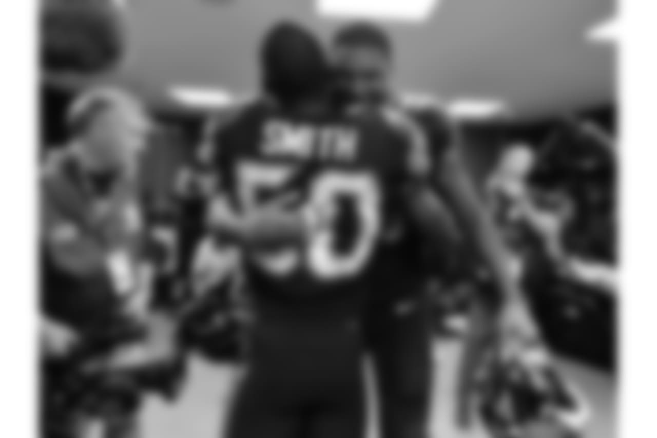 Jacksonville Jaguars defensive end Calais Campbell (93) hugs linebacker Telvin Smith (50) in the locker room following the Jags 44-7 victory against the Baltimore Ravens in an NFL game Sunday, September 24, 2017 in London, U.K. (Rick Wilson via AP)