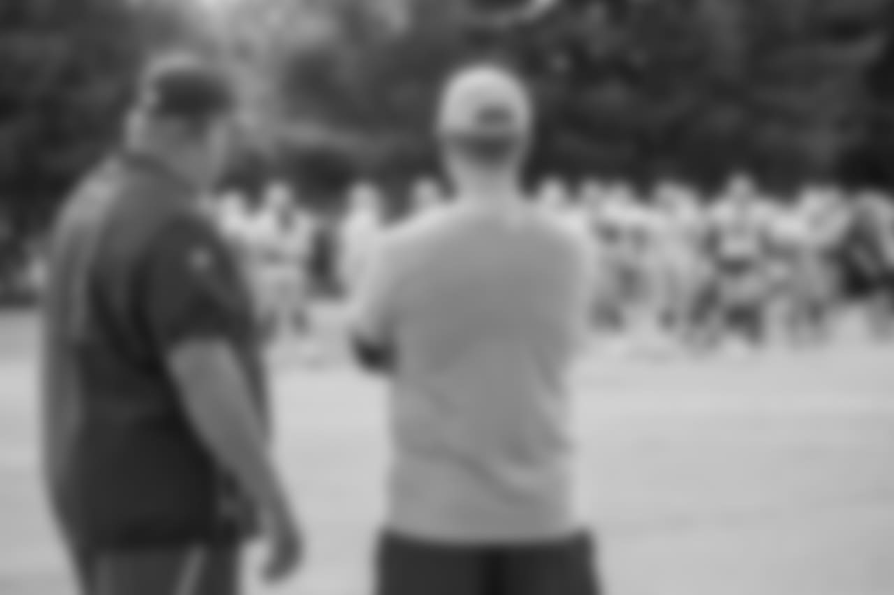 Oakland Raiders general manager Reggie McKenzie talks with Detroit Lions executive vice president and general manager Bob Quin during training camp practice on Tuesday, Aug. 7, 2018 in Napa, Calif. (Detroit Lions via AP)