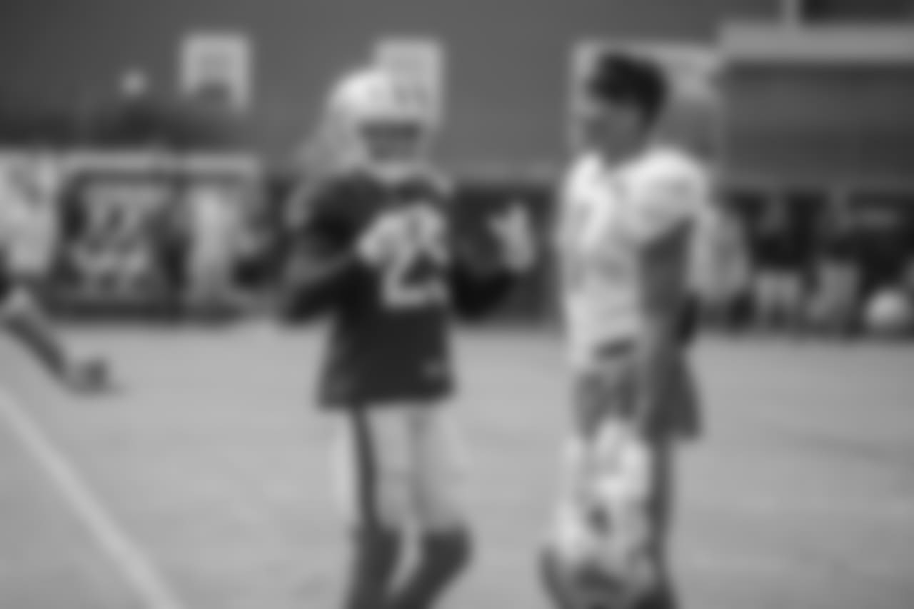 Oakland Raiders cornerback Leon Hall (29) talks with former teammate Detroit Lions wide receiver Marvin Jones Jr. (11) during training camp practice on Tuesday, Aug. 7, 2018 in Napa, Calif. (Detroit Lions via AP)