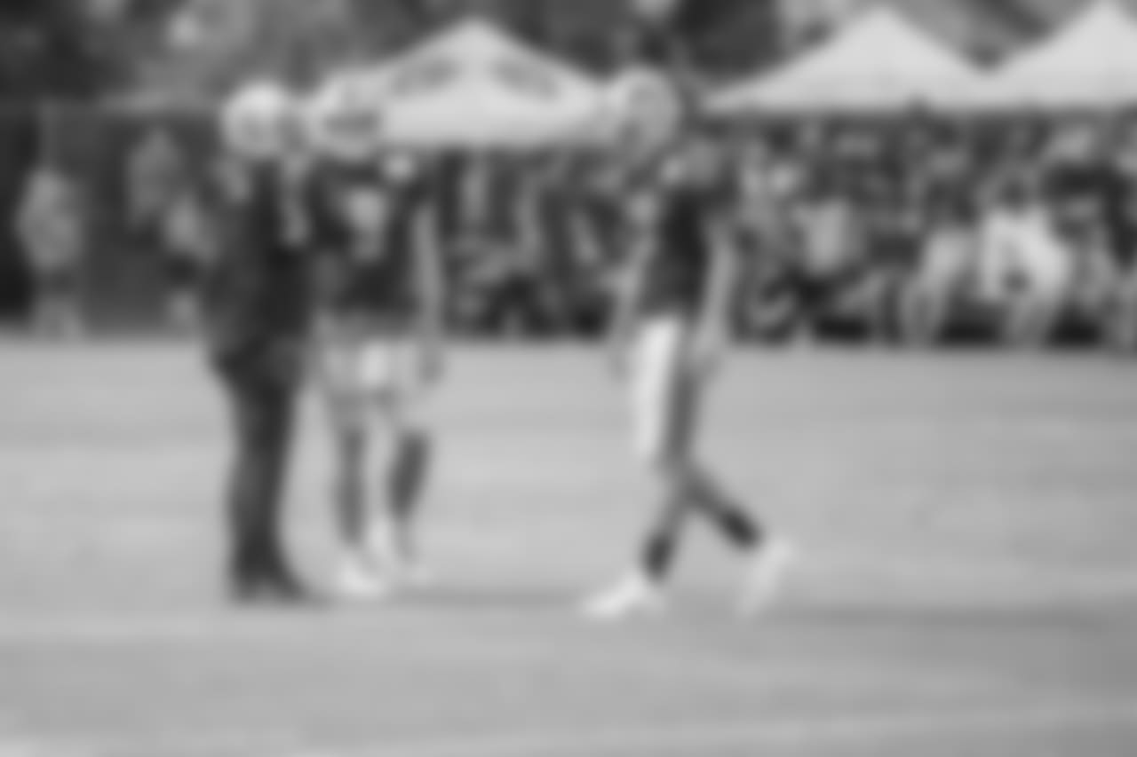 Detroit Lions quarterback Matthew Stafford (9) talks with Oakland Raiders running back Marshawn Lynch (24) during training camp practice on Tuesday, Aug. 7, 2018 in Napa, Calif. (Detroit Lions via AP)