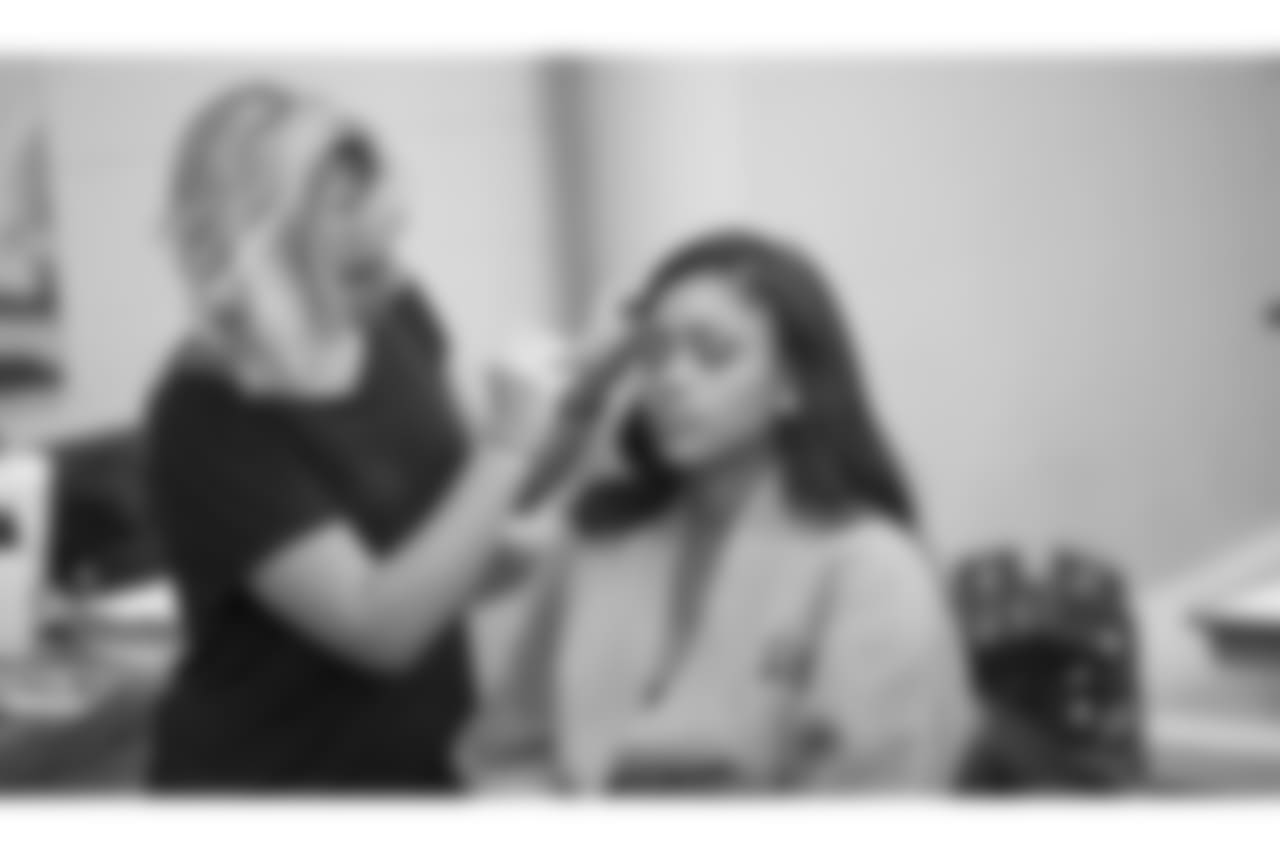 Annalise gets her make-up applied before her first photo of the day