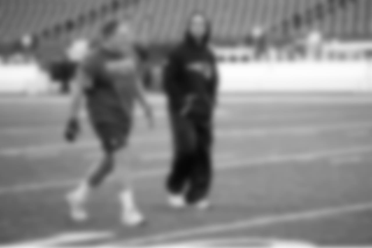 New England Patriots head coach Bill Belichick and head strength and conditioning coach Moses Cabrera walk the field prior to the NFL post season AFC Divisional playoff football game against the Tennessee Titans on Saturday, Jan.13, 2018 in Foxboro, Mass. (Jim Mahoney via AP)