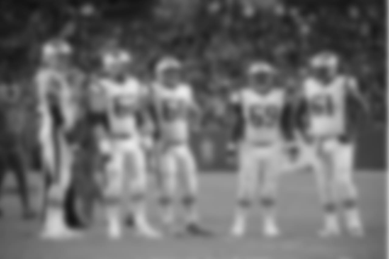 New England Patriots offensive linemen Nate Solder (77), left, Joe Thuney (62), David Andrews (60), Shaq Mason (69) and Marcus Cannon (61) wait to huddle during the first half of an NFL football game against the Tampa Bay Buccaneers Thursday, Oct. 5, 2017, in Tampa, Fla. (AP Photo/Phelan M. Ebenhack)
