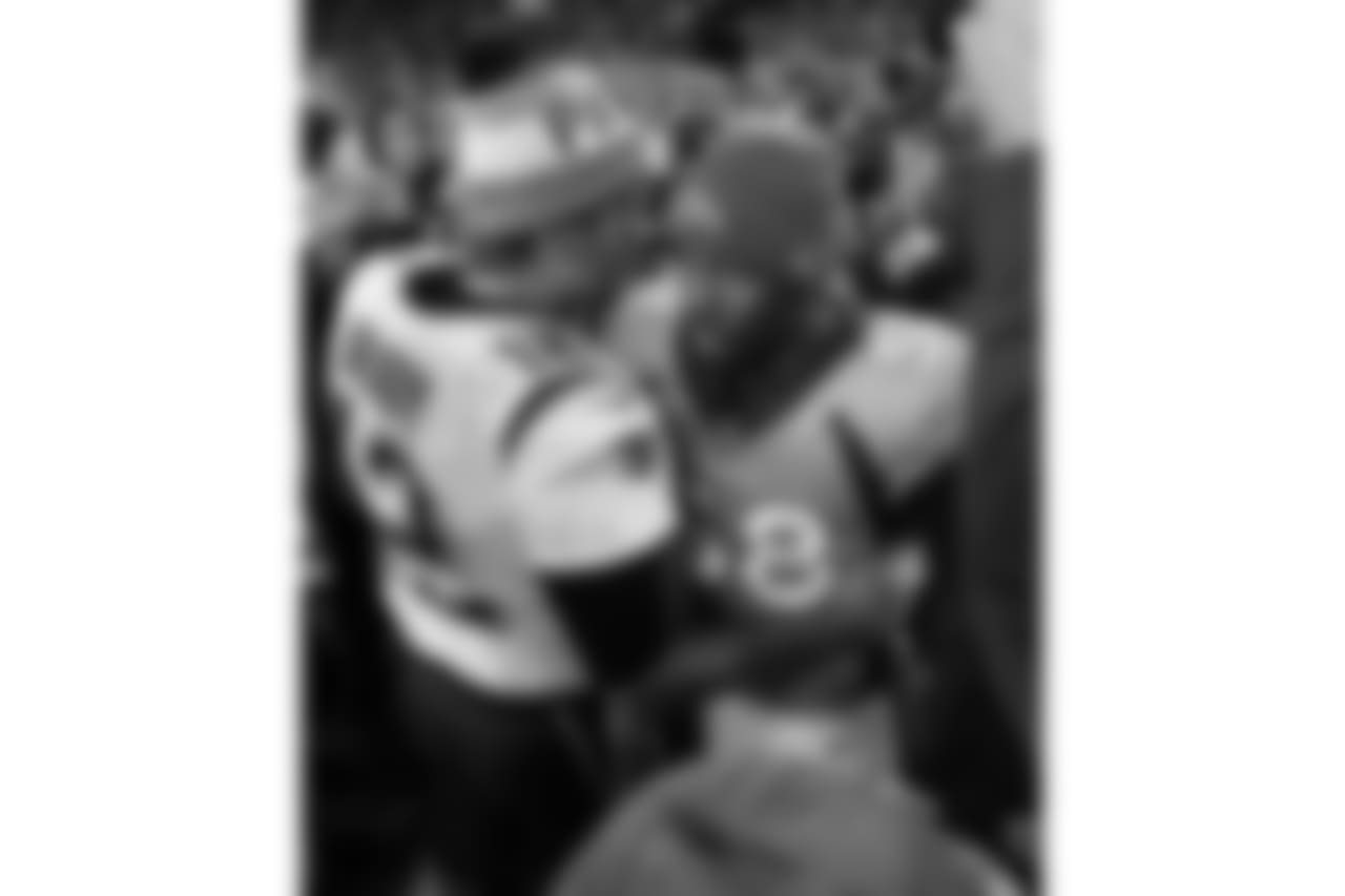 New England Patriots quarterback Tom Brady (12) greets Denver Broncos outside linebacker Von Miller (58) after an NFL football game, Sunday, Nov. 12, 2017, in Denver. The Patriots won 41-16. (AP Photo/Jack Dempsey)