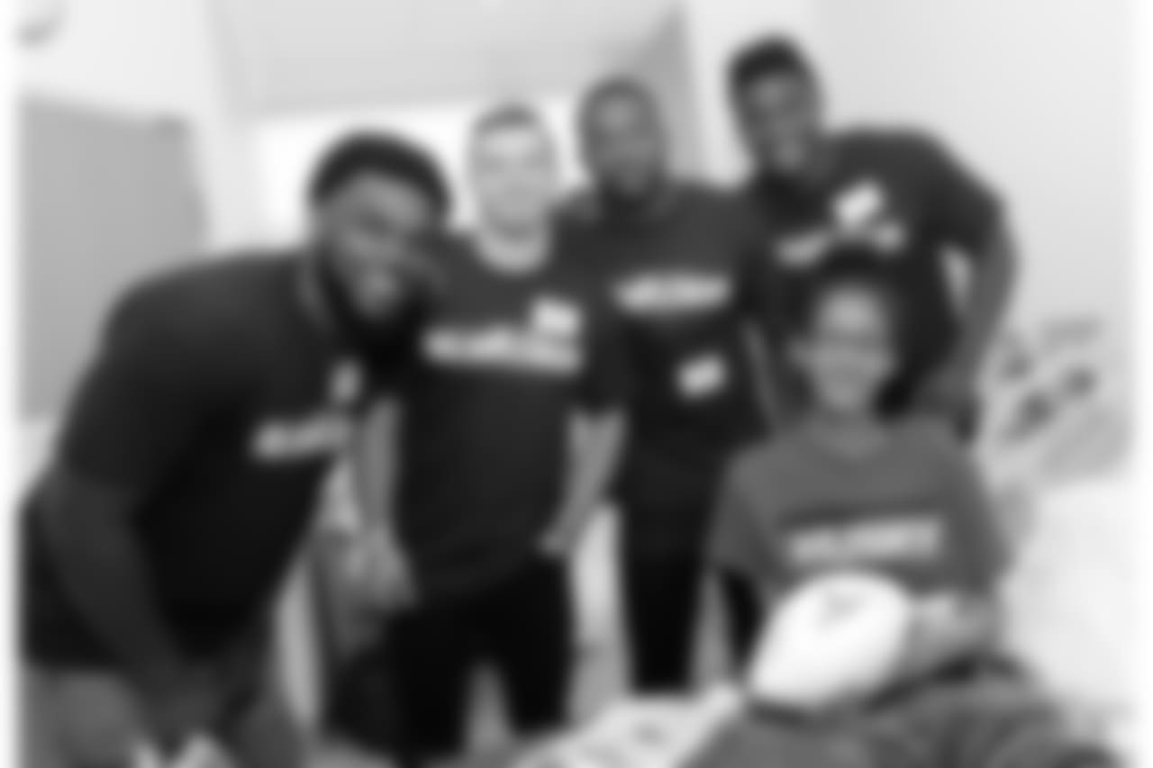 BOSTON, MA - JUNE 20: New England Patriot's rookies (L to R) Ja'Whaun Bentley, Braxton Berrios, Duke Dawson, and Christian Sam visit Kayah at Boston Children's Hospital June 20, 2018 in Boston, Massachusetts. (Photo by Darren McCollester/Getty Images for Boston Children's Hospital)