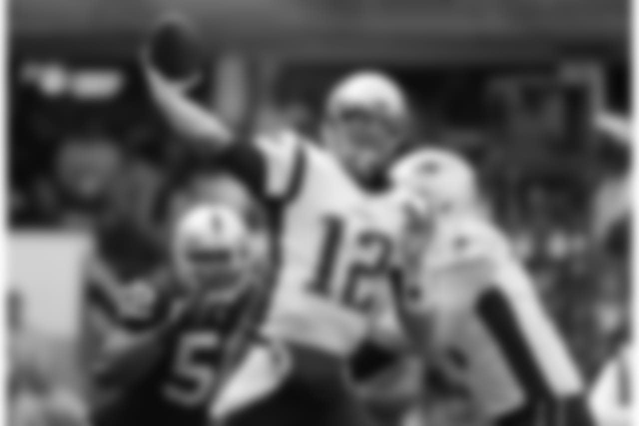 New England Patriots quarterback Tom Brady (12) passes against the Oakland Raiders during the first half of an NFL football game Sunday, Nov. 19, 2017, in Mexico City. (AP Photo/Rebecca Blackwell)