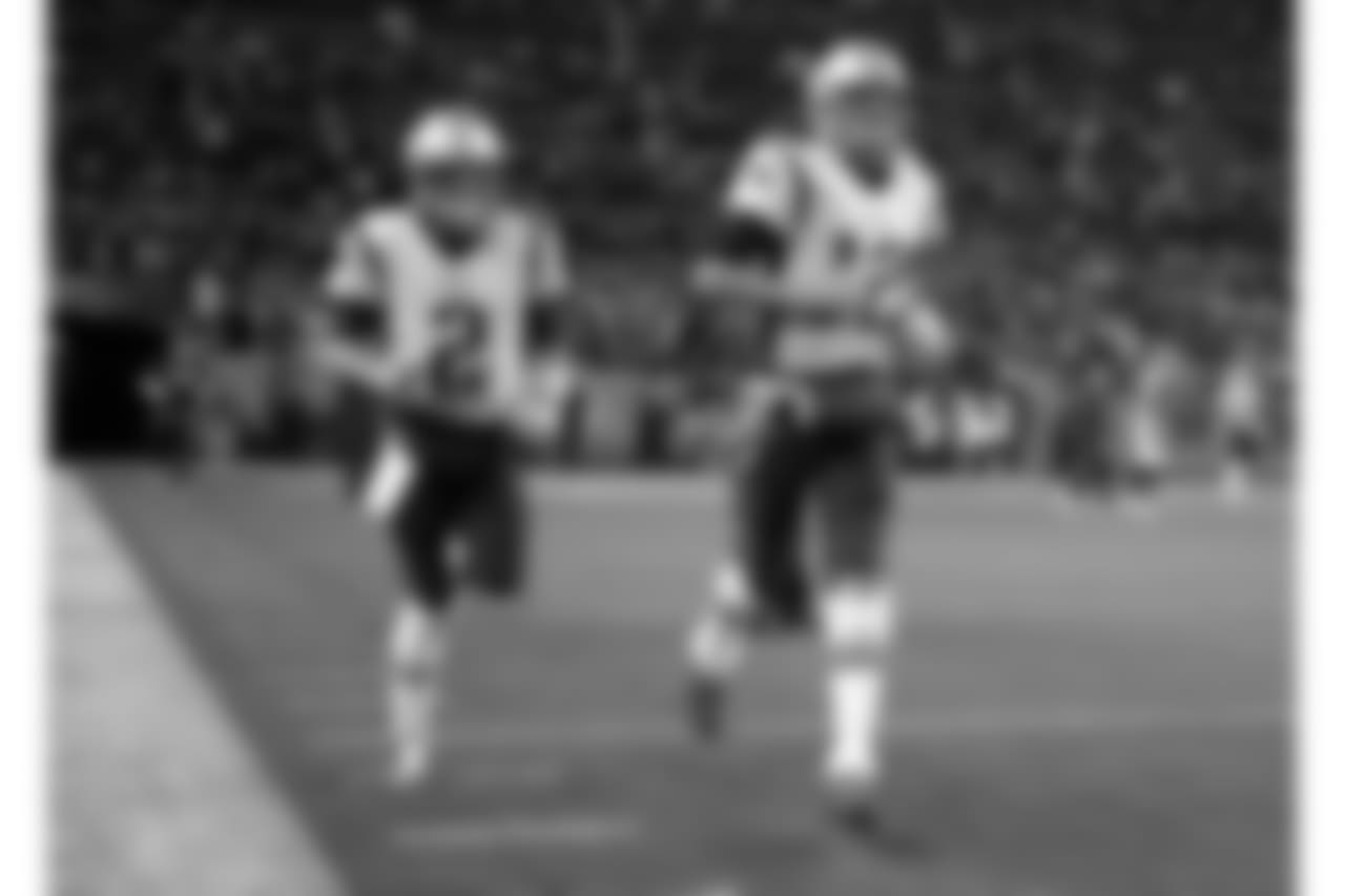 New England Patriots quarterback Tom Brady (12) and quarterback Brian Hoyer (2) take the field prior to an NFL football game against the Denver Broncos, Sunday, Nov. 12, 2017, in Denver. (AP Photo/Jack Dempsey)