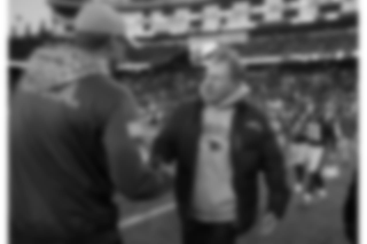 Miami Dolphins head coach Adam Gase, left, and New England Patriots head coach Bill Belichick speak at midfield after an NFL football game, Sunday, Nov. 26, 2017, in Foxborough, Mass. (AP Photo/Michael Dwyer)