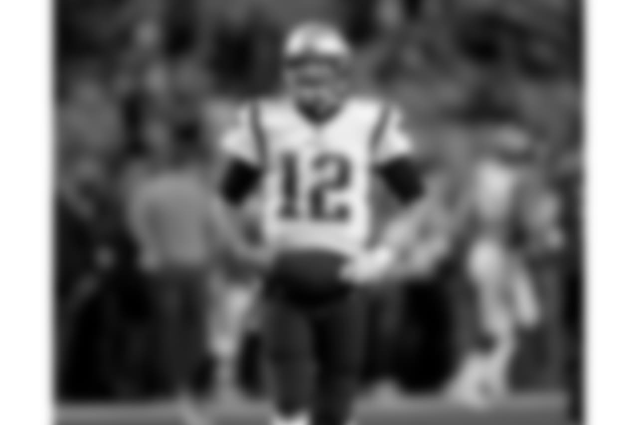 New England Patriots quarterback Tom Brady (12) warms up prior to an NFL football game against the Denver Broncos, Sunday, Nov. 12, 2017, in Denver. (AP Photo/David Zalubowski)