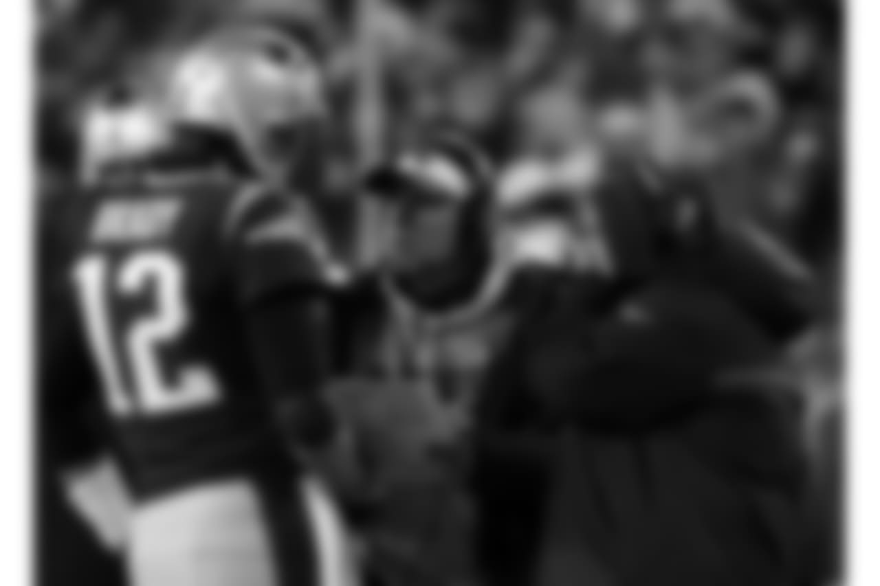 New England Patriots quarterback Tom Brady, left, talks to offensive coordinator Josh McDaniels, center, and head coach Bill Belichick, right, during a timeout in the first half of an NFL divisional playoff football game against the Tennessee Titans, Saturday, Jan. 13, 2018, in Foxborough, Mass. (AP Photo/Michael Dwyer)