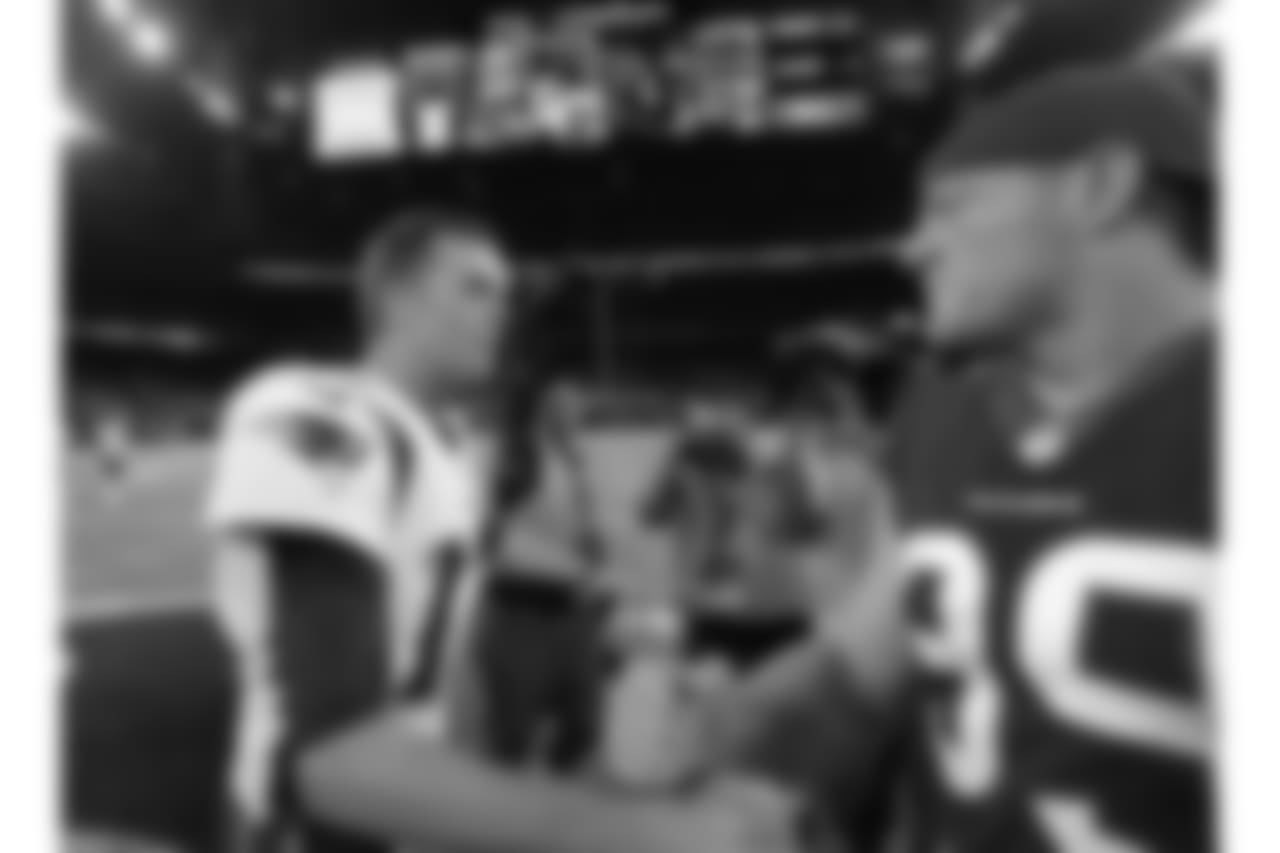 New England Patriots quarterback Tom Brady, left, greets Houston Texans defensive end J.J. Watt, right, following an NFL football preseason game Saturday, Aug. 19, 2017, in Houston. (AP Photo/David J. Phillip)