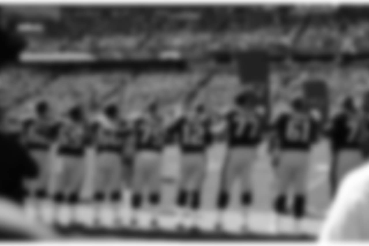 Members of the New England Patriots stand along the sideline during the national anthem before an NFL football game against the Carolina Panthers, Sunday, Oct. 1, 2017, in Foxborough, Mass. (AP Photo/Charles Krupa)