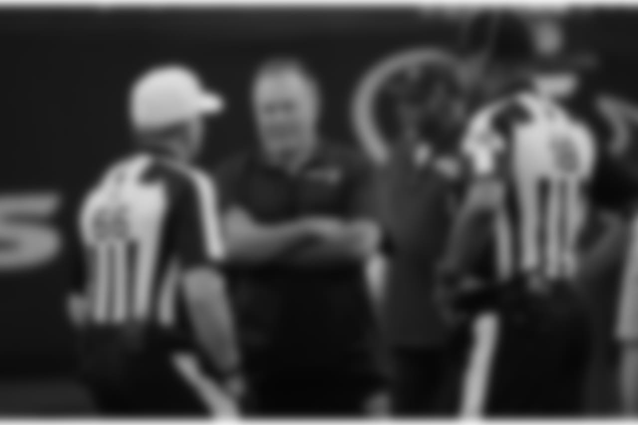 New England Patriots head coach Bill Belichick, center, talks with officials before an NFL football preseason game against the Houston Texans Saturday, Aug. 19, 2017, in Houston. (AP Photo/David J. Phillip)