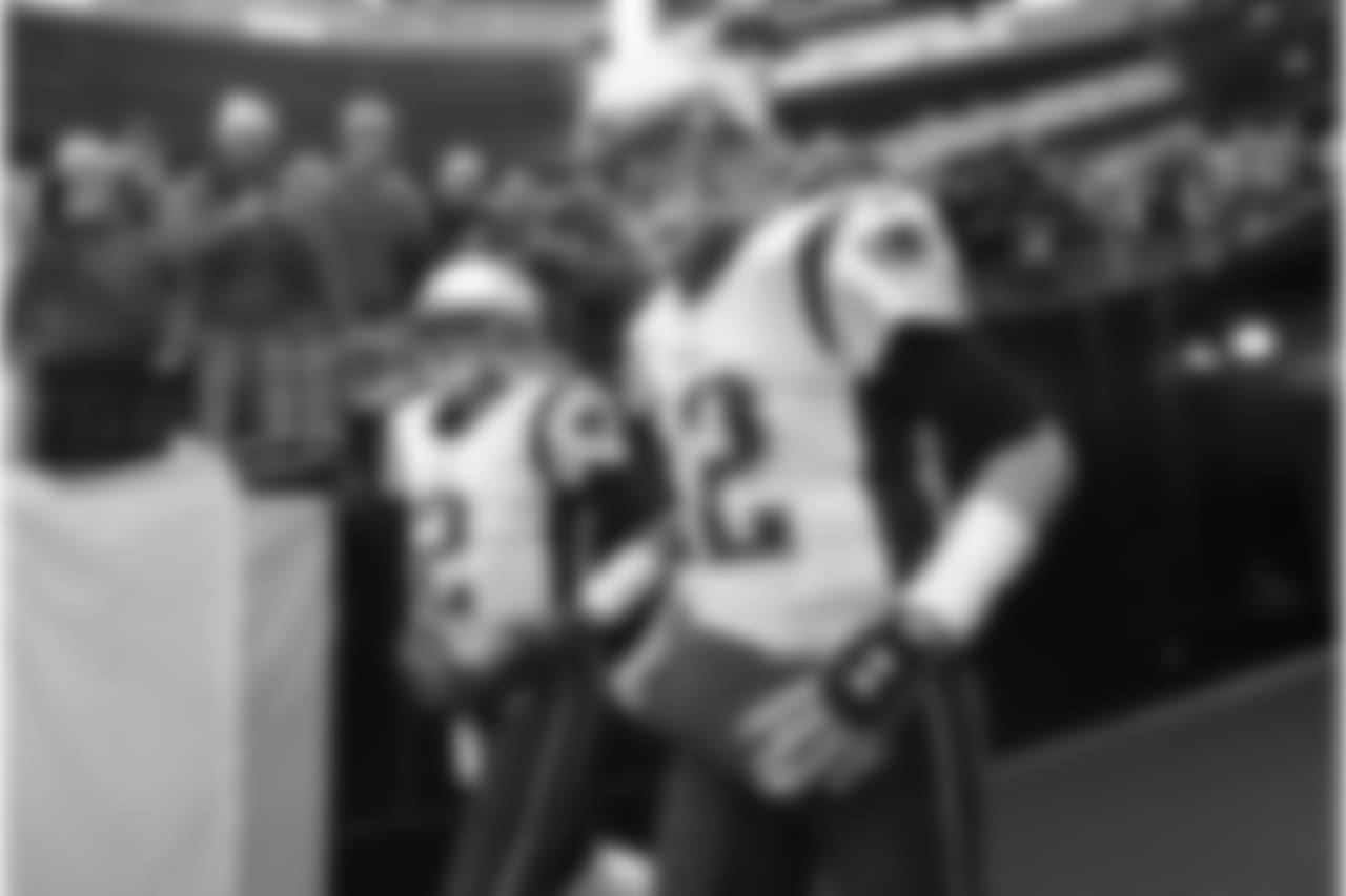 New England Patriots quarterbacks Tom Brady (12) and Brian Hoyer (2) run onto the field for warm ups before an NFL football game against the Pittsburgh Steelers in Pittsburgh, Sunday, Dec. 17, 2017. (AP Photo/Don Wright)