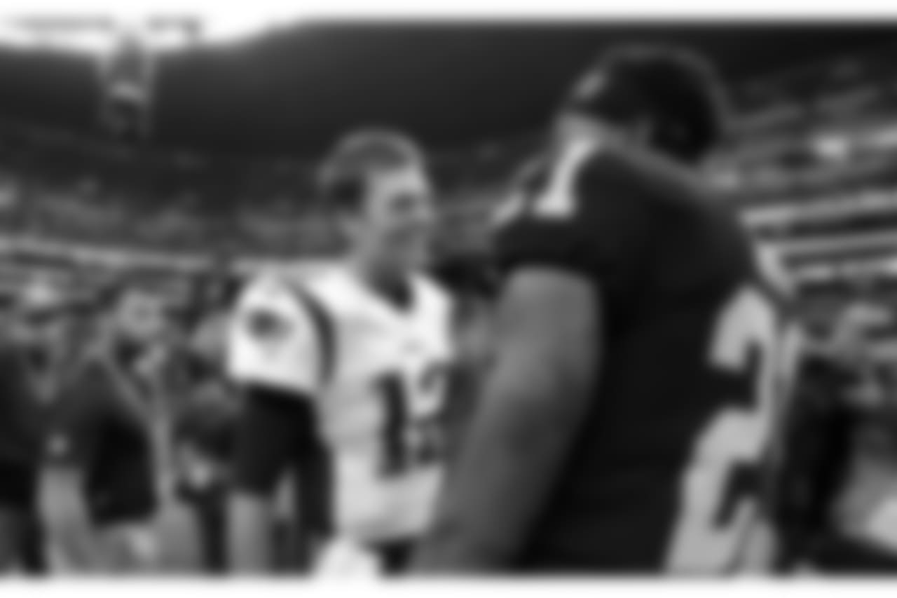 New England Patriots quarterback Tom Brady, left, talks with Oakland Raiders cornerback Sean Smith, right, after an NFL football game Sunday, Nov. 19, 2017, in Mexico City. (AP Photo/Rebecca Blackwell)