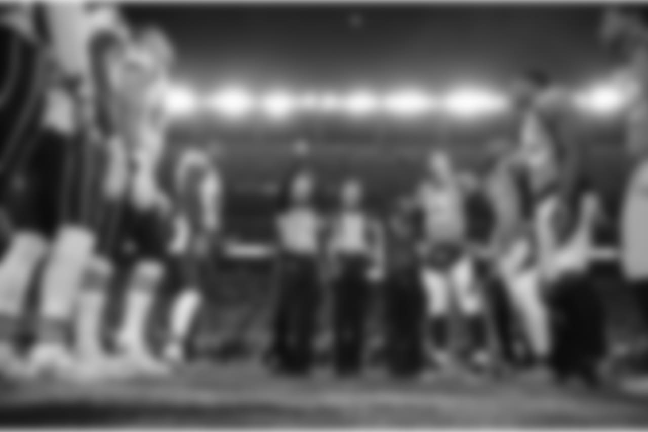 The Denver Broncos and the New England Patriots stand at mid field for the coin toss prior to an NFL football game, Sunday, Nov. 12, 2017, in Denver. (AP Photo/Jack Dempsey)