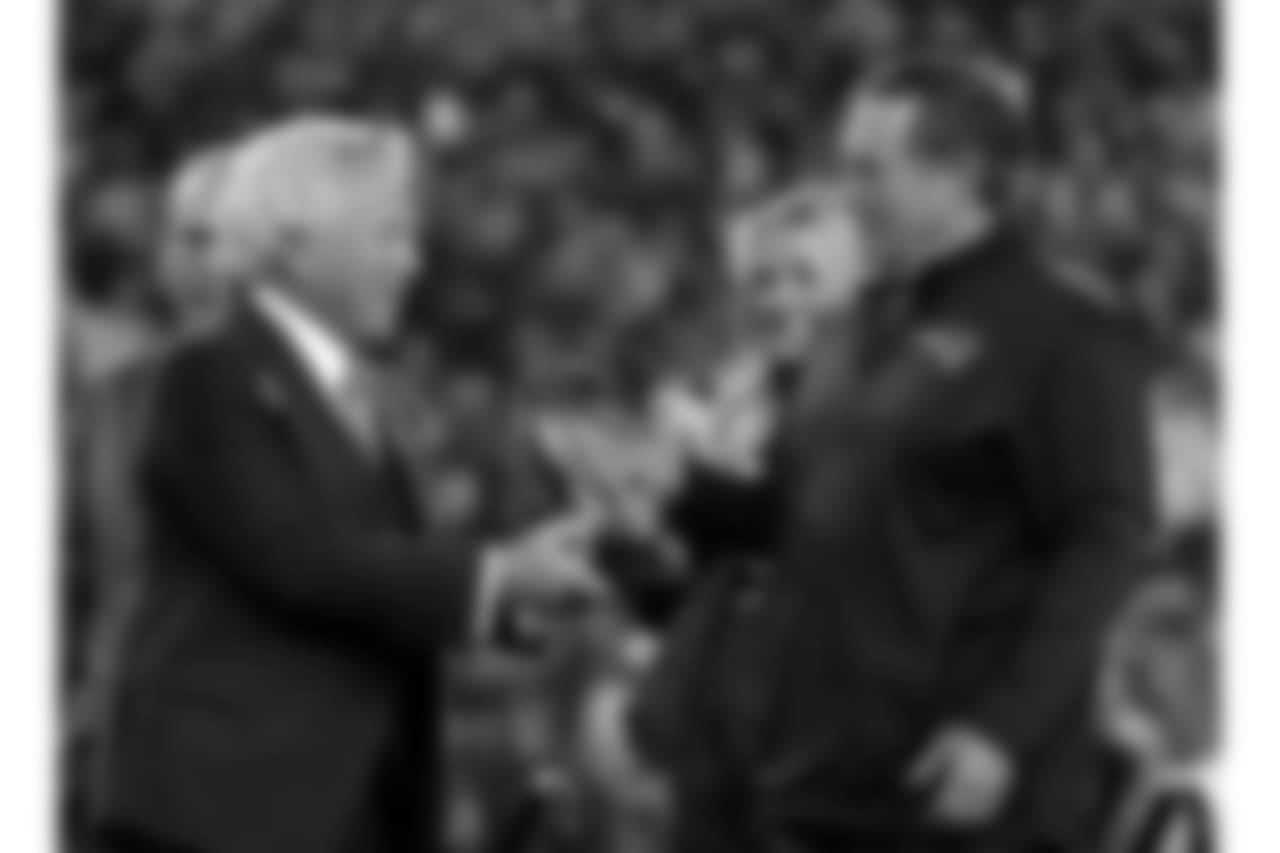 New England Patriots owner Robert Kraft, left, hand the trophy to head coach Bill Belichick after the AFC championship NFL football game against the Jacksonville Jaguars, Sunday, Jan. 21, 2018, in Foxborough, Mass. The Patriots won 24-20. (AP Photo/Winslow Townson)