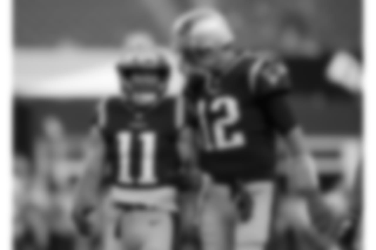 New England Patriots wide receiver Julian Edelman (11) talks with quarterback Tom Brady (12) before a preseason NFL football game against the Washington Redskins, Thursday, Aug. 9, 2018, in Foxborough, Mass. (AP Photo/Charles Krupa)