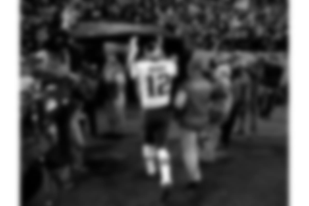New England Patriots quarterback Tom Brady (12) cheers Patriots fans as he leaves the field after an NFL football game against the Denver Broncos, Sunday, Nov. 12, 2017, in Denver. The Patriots won 41-16. (AP Photo/Jack Dempsey)