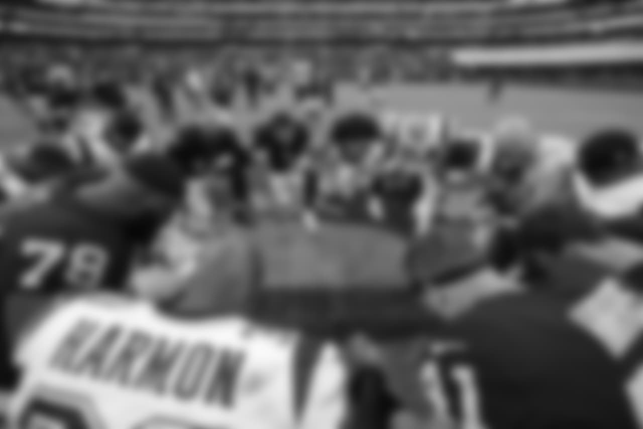New England Patriots strong safety Duron Harmon kneels with teammates and Oakland Raiders players following an NFL football game Sunday, Nov. 19, 2017, in Mexico City. (AP Photo/Rebecca Blackwell)