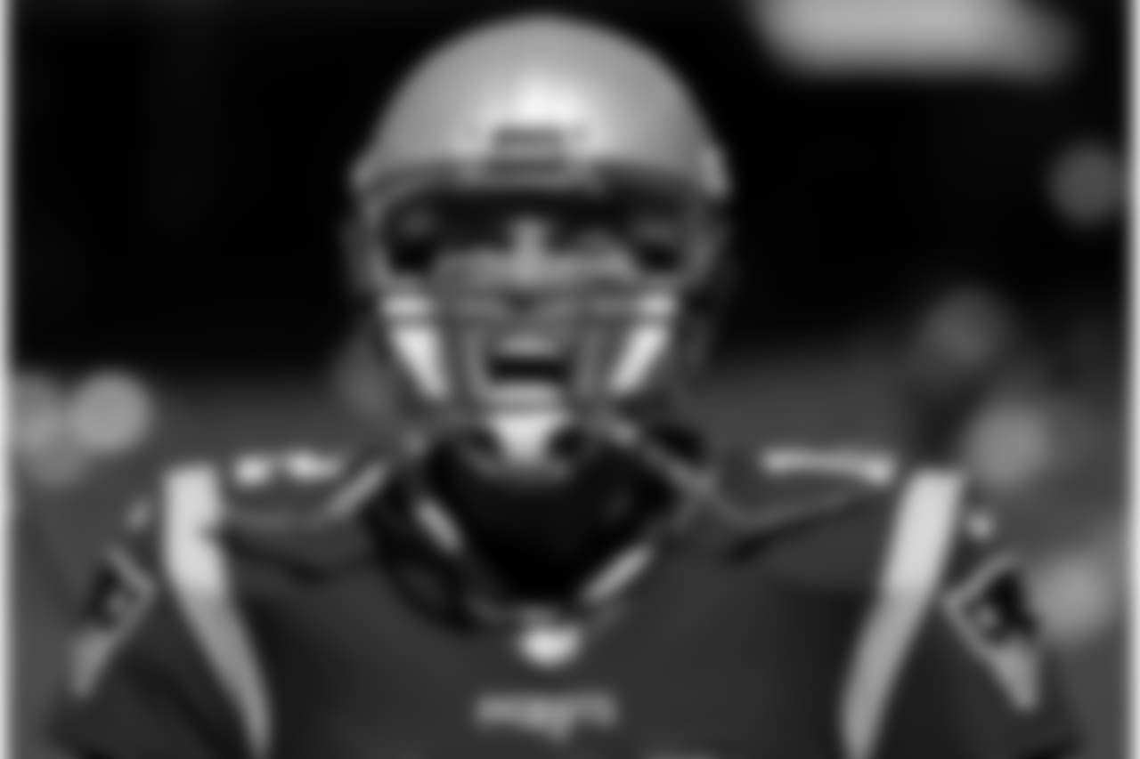 New England Patriots quarterback Tom Brady charges onto the field for to warm up before an NFL football game against the Carolina Panthers, Sunday, Oct. 1, 2017, in Foxborough, Mass. (AP Photo/Charles Krupa)