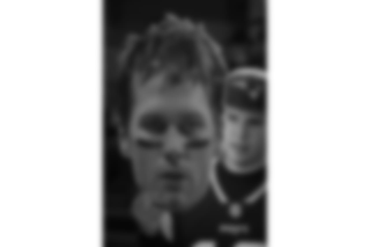 A fan holds an image of New England Patriots quarterback Tom Brady before an NFL football game against the Oakland Raiders, Sunday, Nov. 19, 2017, in Mexico City. (AP Photo/Eduardo Verdugo)