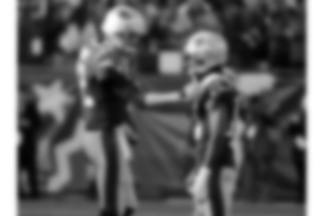 New England Patriots quarterback Tom Brady, left, talks to wide receiver Brandin Cooks as they warm up before the AFC championship NFL football game against the Jacksonville Jaguars, Sunday, Jan. 21, 2018, in Foxborough, Mass. (AP Photo/David J. Phillip)