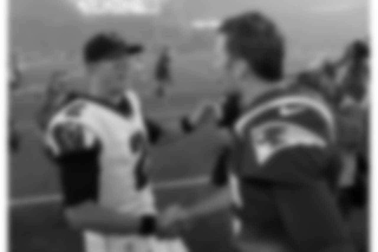 Atlanta Falcons quarterback Matt Ryan, left, and New England Patriots quarterback Tom Brady, right, speak at midfield after an NFL football game, Sunday, Oct. 22, 2017, in Foxborough, Mass. (AP Photo/Charles Krupa)
