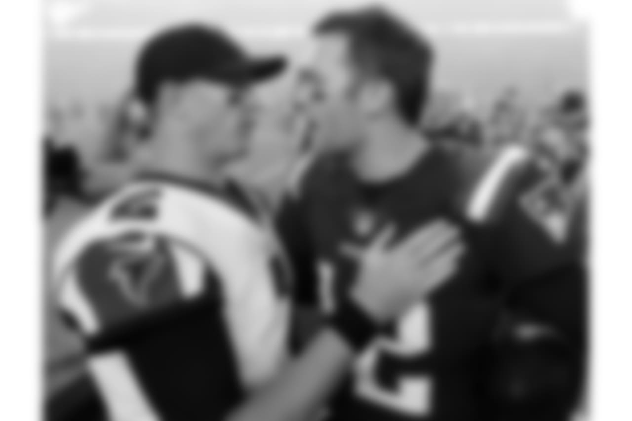 Atlanta Falcons quarterback Matt Ryan, left, and New England Patriots quarterback Tom Brady, right, speak at midfield after an NFL football game, Sunday, Oct. 22, 2017, in Foxborough, Mass. (AP Photo/Steven Senne)