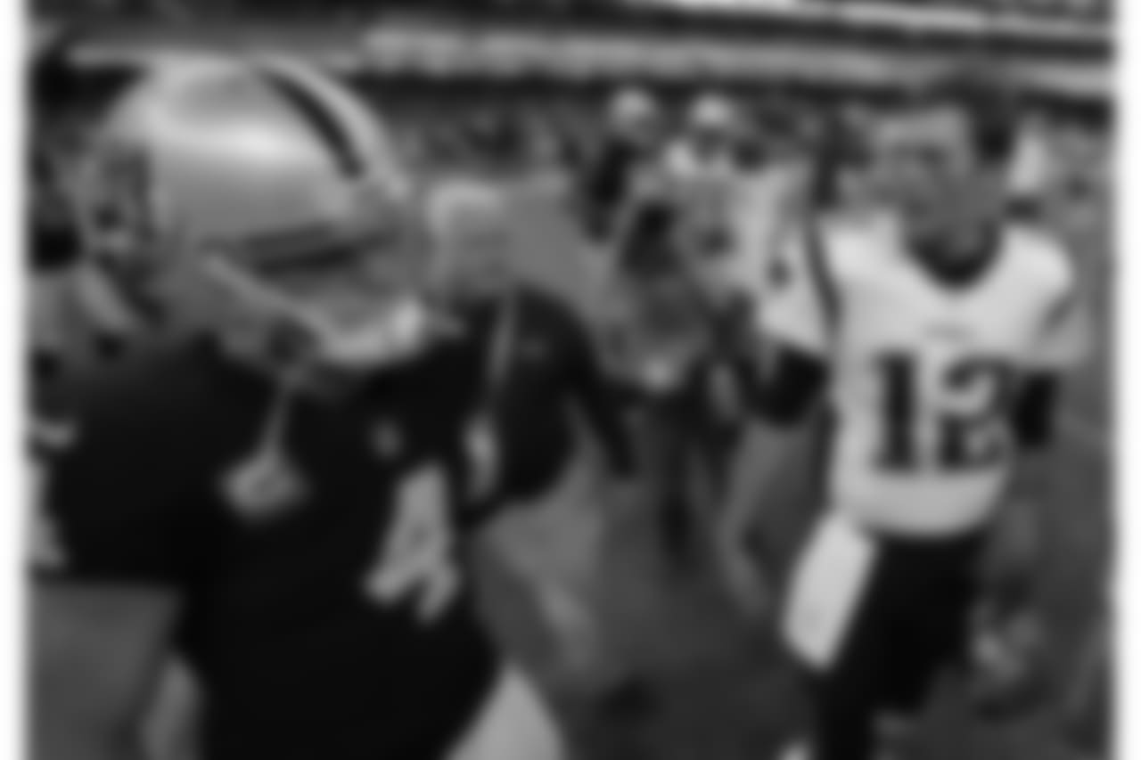 New England Patriots quarterback Tom Brady, right, talks with Oakland Raiders quarterback Derek Carr (4) after an NFL football game Sunday, Nov. 19, 2017, in Mexico City. (AP Photo/Eduardo Verdugo)