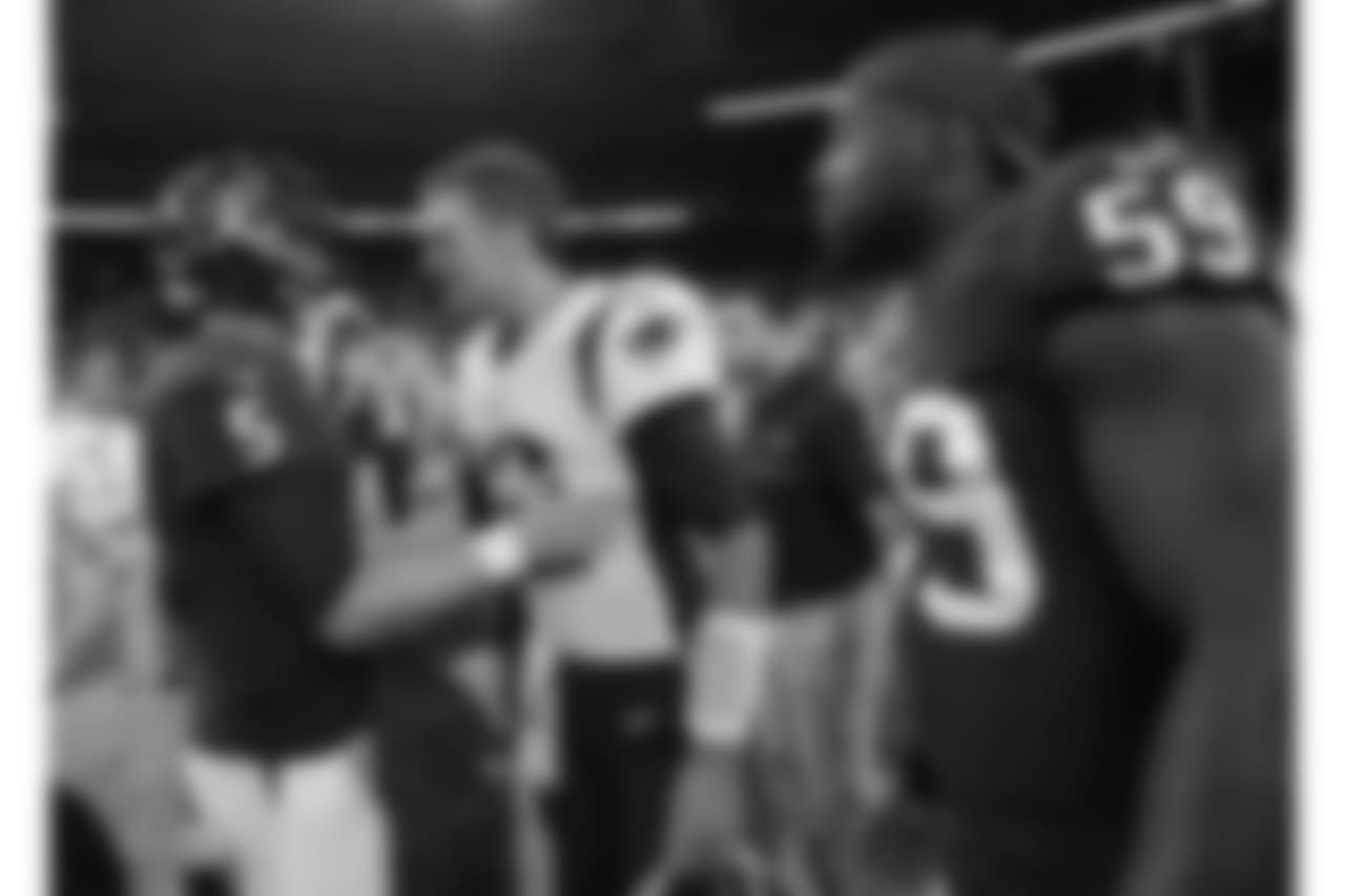New England Patriots quarterback Tom Brady, center, greets Houston Texans quarterback Brandon Weeden (5) following an NFL football preseason game Saturday, Aug. 19, 2017, in Houston. (AP Photo/David J. Phillip)