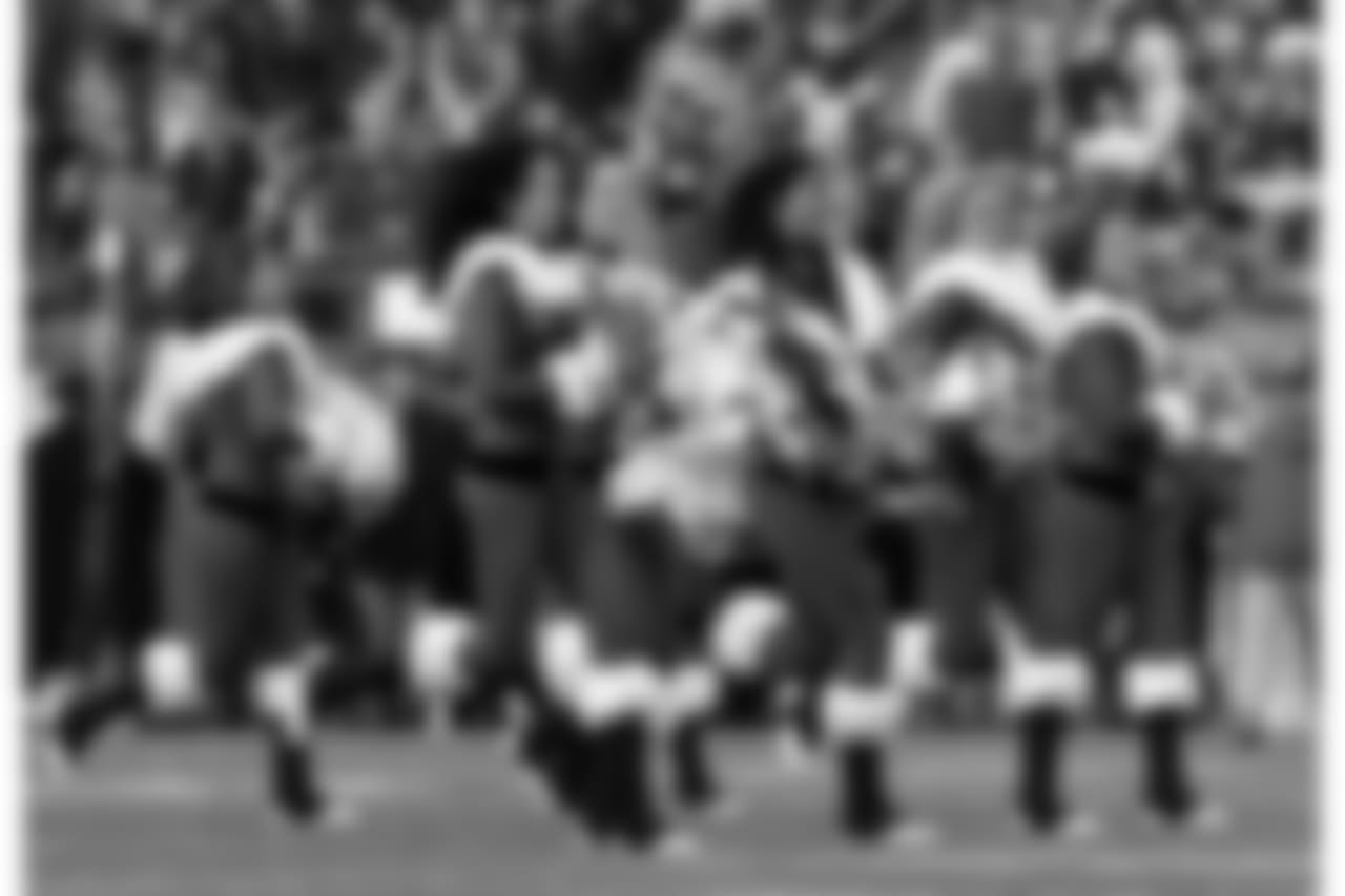 The New England Patriots cheerleaders perform wearing Christmas outfits before an NFL football game between the Patriots and the Buffalo Bills, Sunday, Dec. 24, 2017, in Foxborough, Mass. (AP Photo/Charles Krupa)